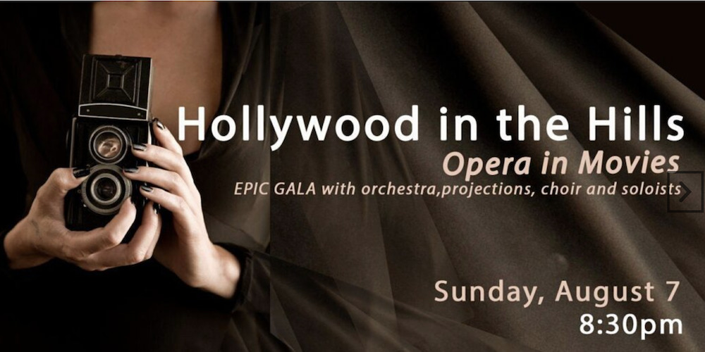 female hands holding a camera with the advertising for the Event