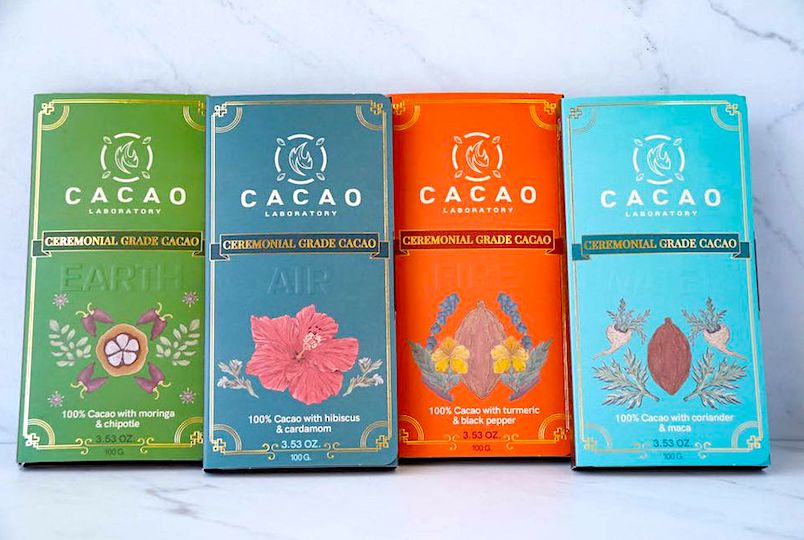 four different cacao bars wrapped up in packaging