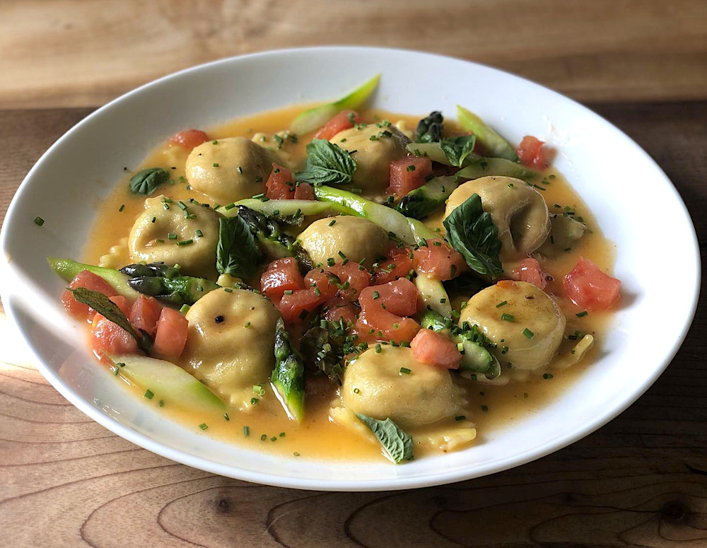 lobster raviolis and veggies in a bowl