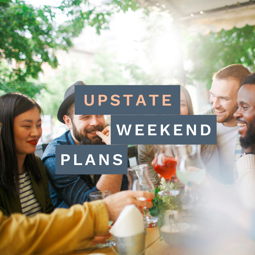 Mixed group of people all smiling and toasting each other with their various drinks in the summertime