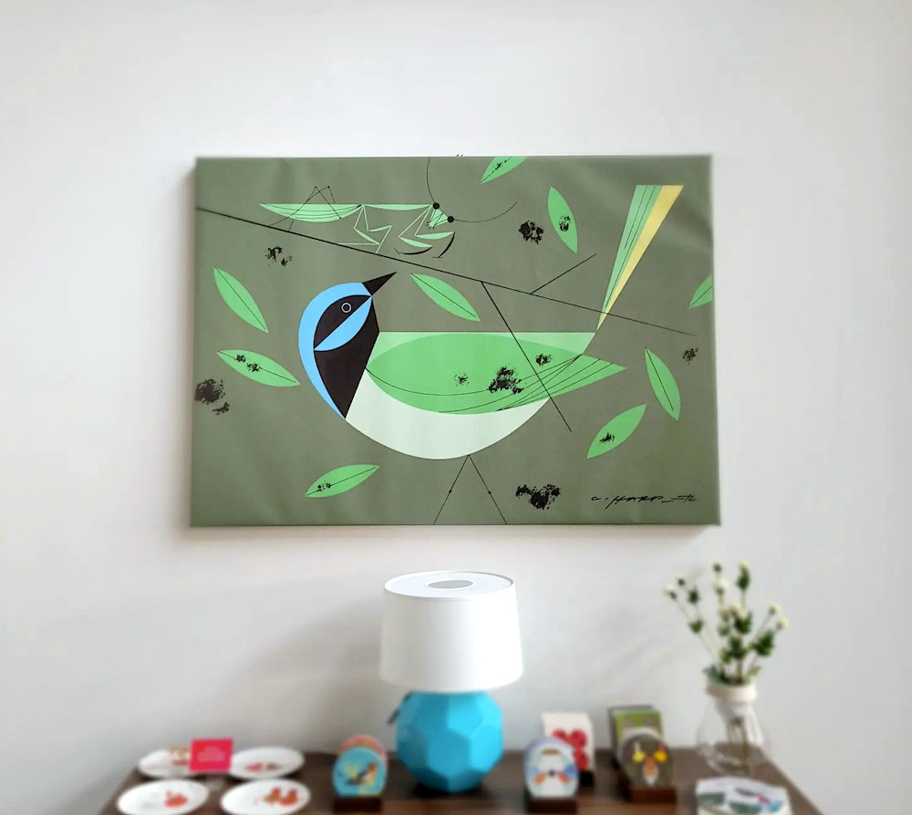 green painting of a bird on the wall