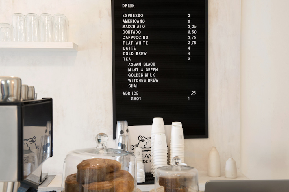 menu behind the counter at a cafe