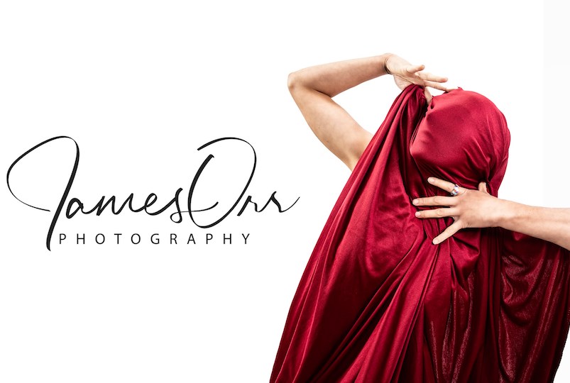 woman in red material with James Orr logo