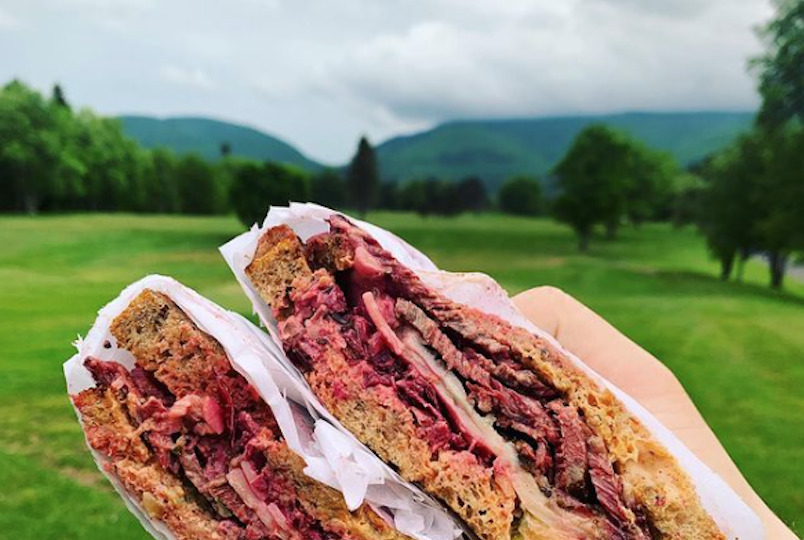 picture of sandwich and golf course in the background