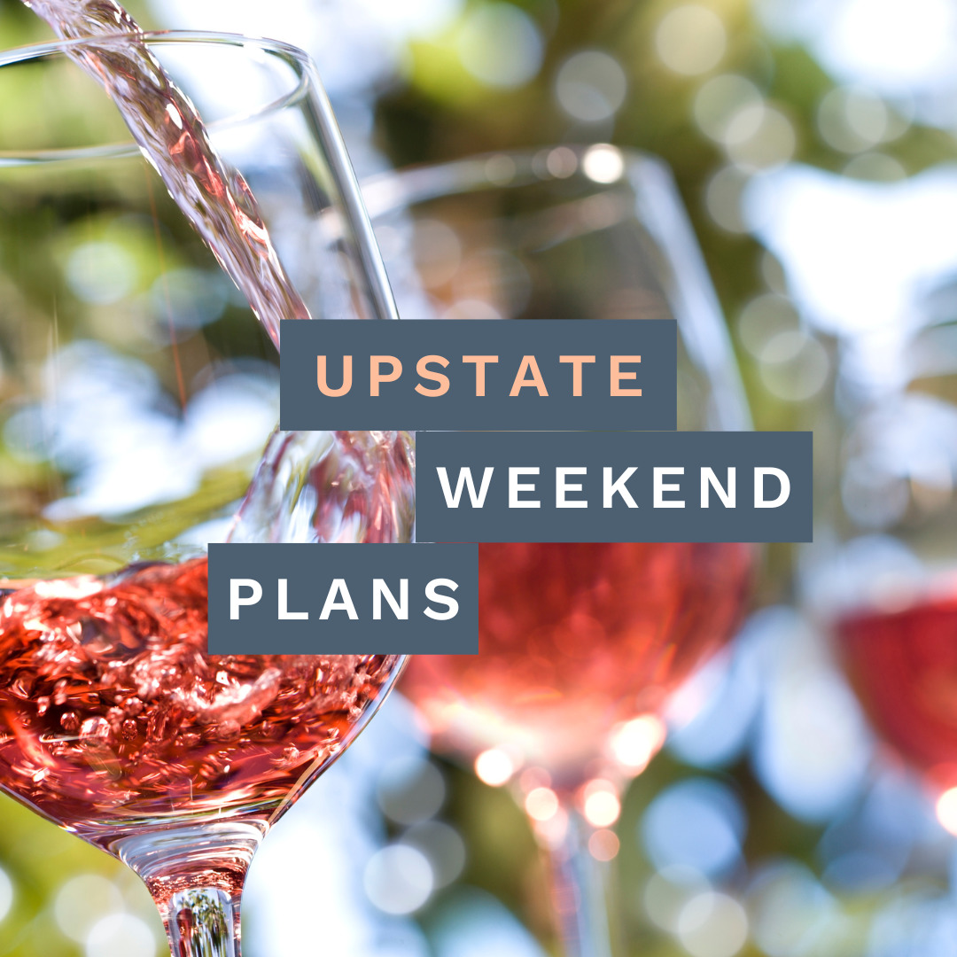 rose wine glasses with sign, "Upstate Weekend Plans"