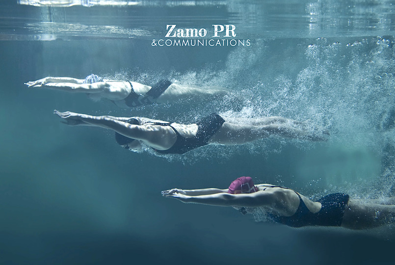 3 women diving, underwater
