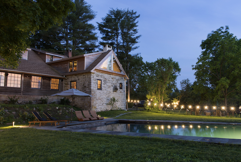 house and pool at twilight
