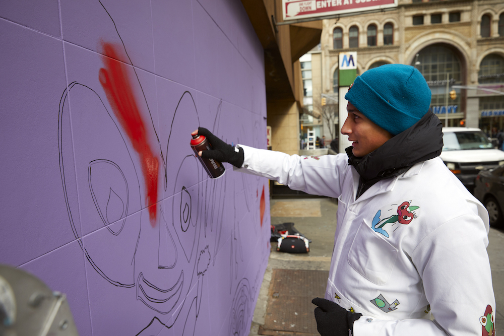 spray painting a mural