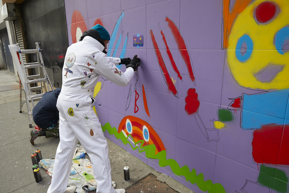 spray painting a mural