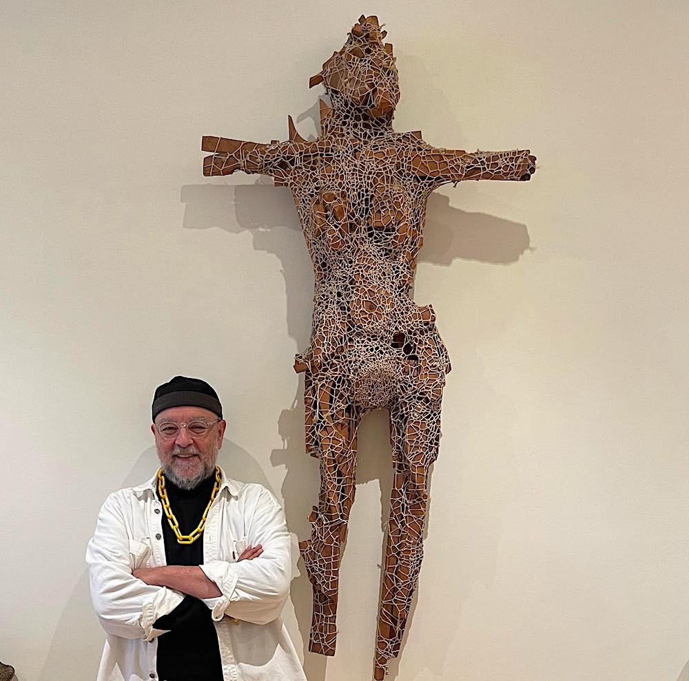 Rene Moncada in front of his sculpture at Jane St. Art Center
