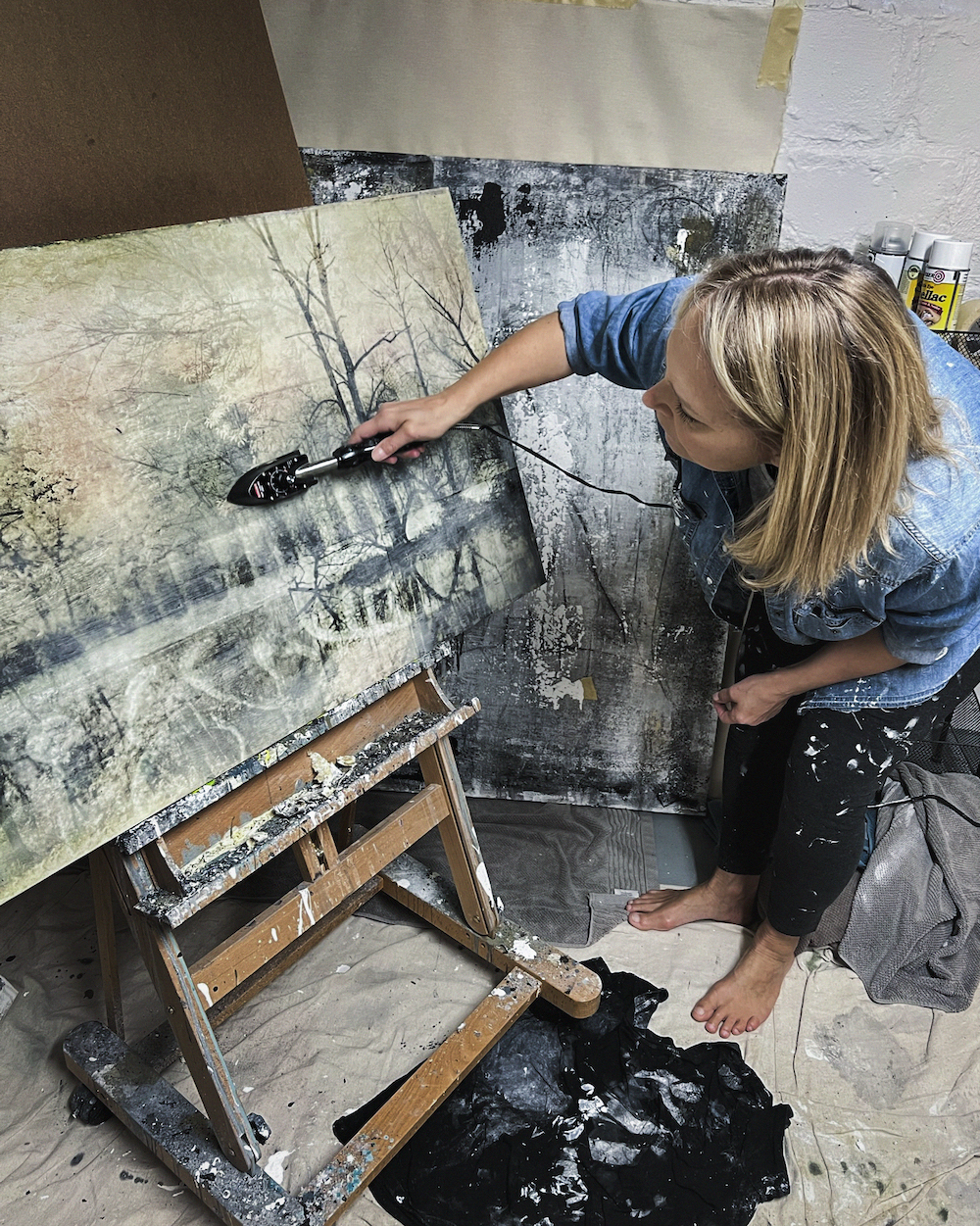 Helena Palazzi using a hot iron on her painting