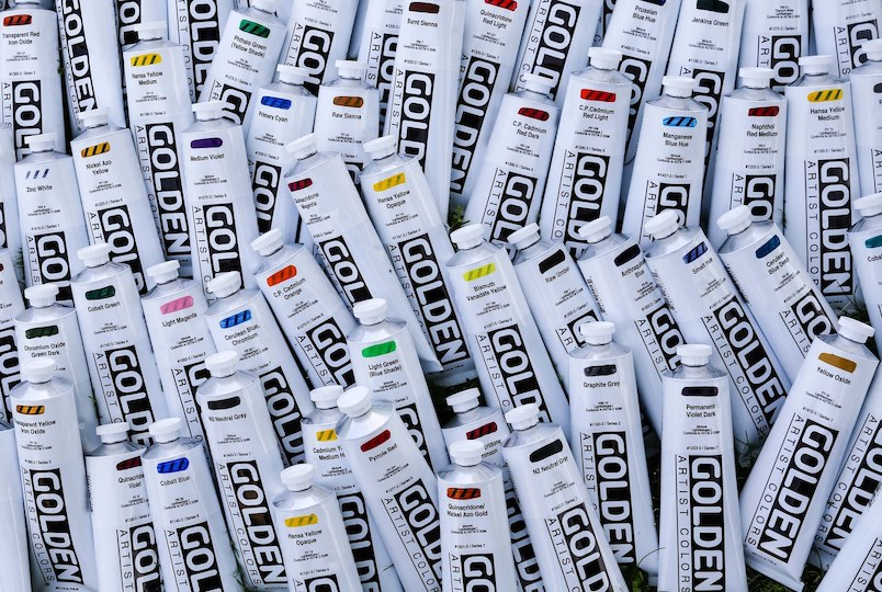 bunch of different colors of paint in tubes