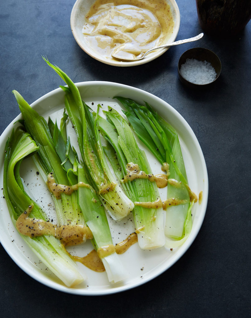 leeks with a French vinaigrette drizzled over them styled by Food Stylist Liza Jernow in Kerhonkson, NY