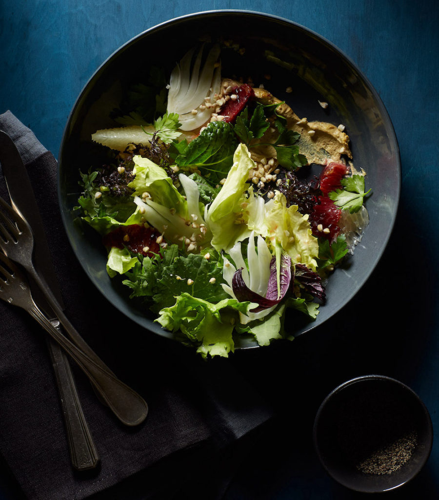 Salad in a bowl in the dark with sparse light created by Food Stylist Liza Jernow in Kerhonkson, NY