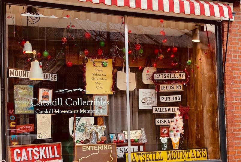 Catskill Collectibles storefront window with antiques from Catskill NY