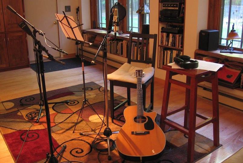 A guitar and other instruments in a studio with microphone to record music at Cold Brook Productions in Bearsville NY