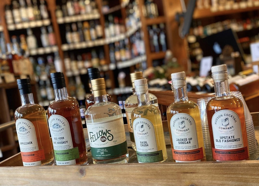 multiple bottles of spirits on the counter at Woodstock Wine & Liquors in Woodstock, NY