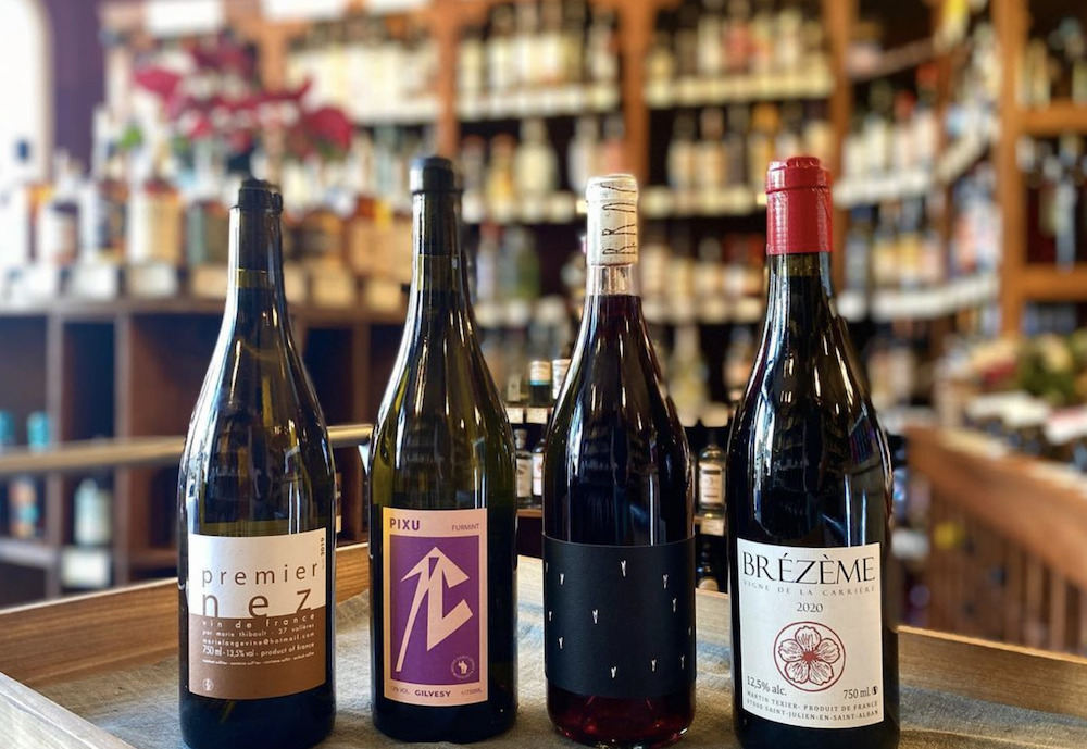 four bottles of wine lined up on the counter at Woodstock Wine & Liquors in Woodstock, NY