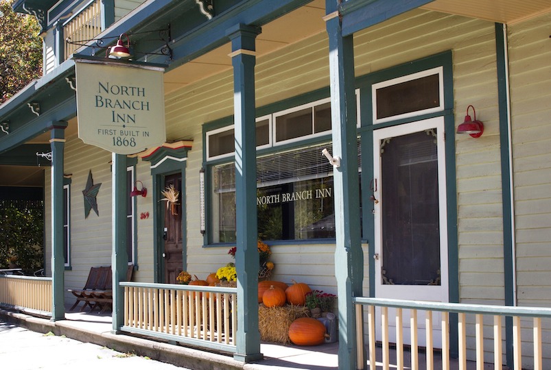 Front porch, sign and door at The North Branch Inn in North Branch NY