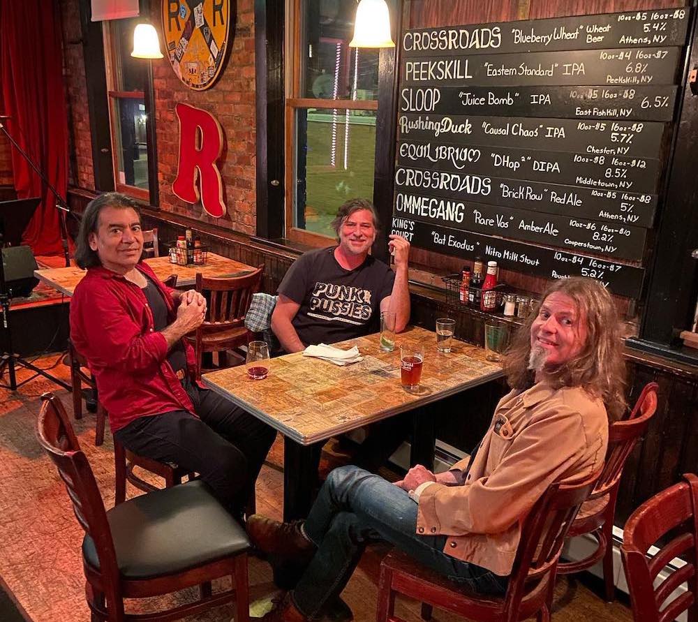 Three people hanging out and talking at Dogwood Bar in Beacon NY