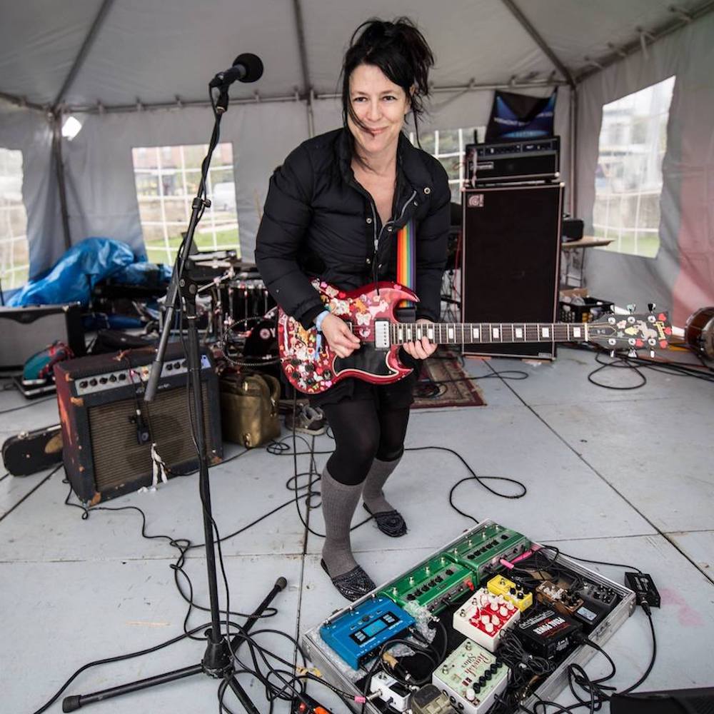 Shana Falana doing a sound check under a tent at the Walking Windows Festival in Vermont