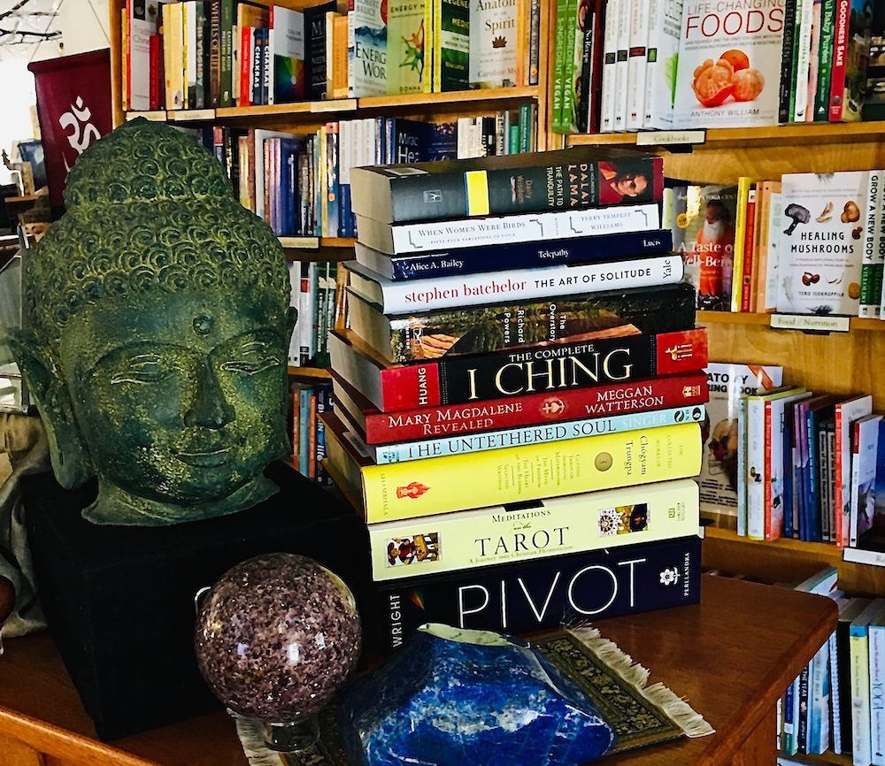 Buddha bust with books in Mirabai Books in Woodstock NY